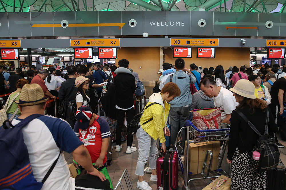 Passengers are seen at KLIA2 in Sepang August 22, 2019, during a systems outage. u00e2u20acu201d Picture by Yusof Mat Isa