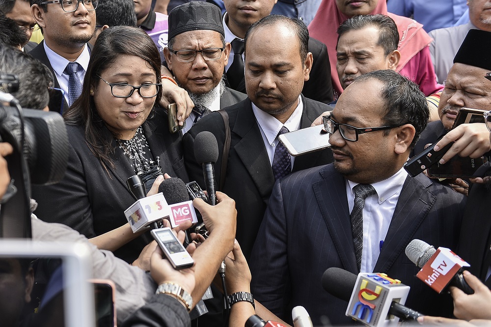 Lawyers representing Adib's family, Shazlin Mansor Shazlin Mansor (left) and Mohd Kamaruzaman A Wahab (right) speak during a press conference outside the Shah Alam court complex September 27, 2019. u00e2u20acu201d Picture by Miera Zulyana