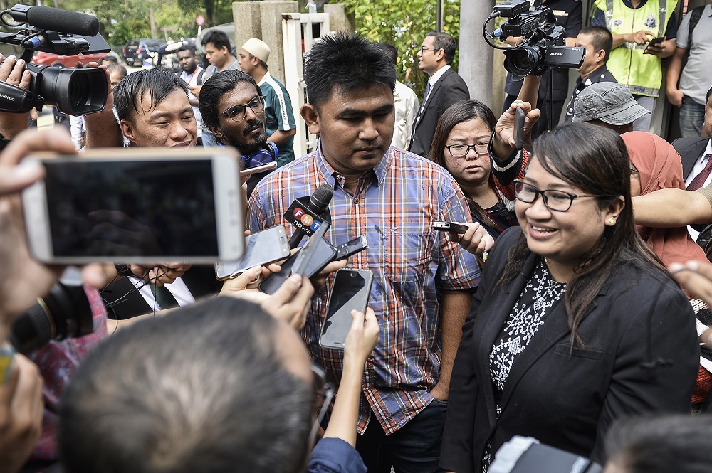 Firefighter Muhammad Adib Mohd Kassimu00e2u20acu2122s brother, Mohd Asraf Mohd Kassim, speaks during a press conference outside the Shah Alam court complex September 27, 2019. u00e2u20acu201d Picture by Miera Zulyana