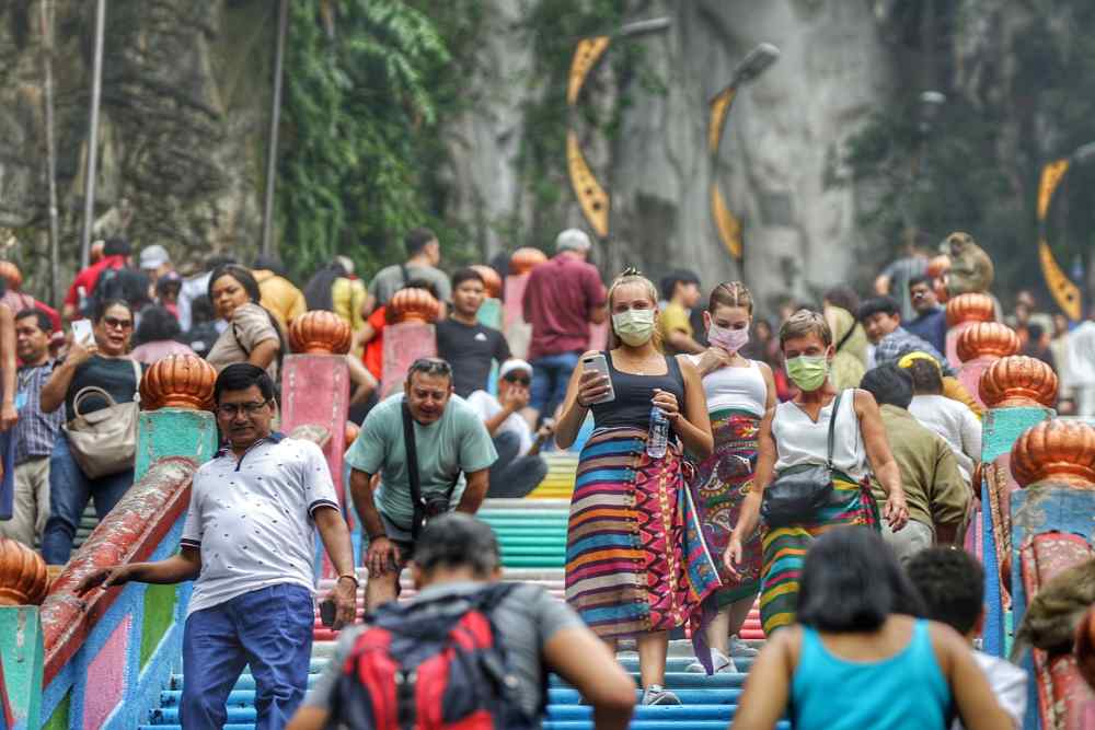 Tourists wear masks while visiting Batu Caves September 19, 2019. u00e2u20acu2022 Picture by Ahmad Zamzahuri