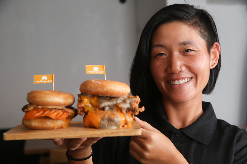 MyBurgerLab's Marketing Manager Sasha Lim with this year's special collaboration with Krispy Kreme.