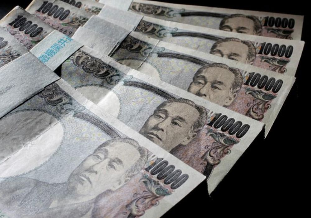 Illustrative picture shows Japanese 10,000 yen bank notes spread out at an office of World Currency Shop in Tokyo, August 9, 2010. — Reuters pic