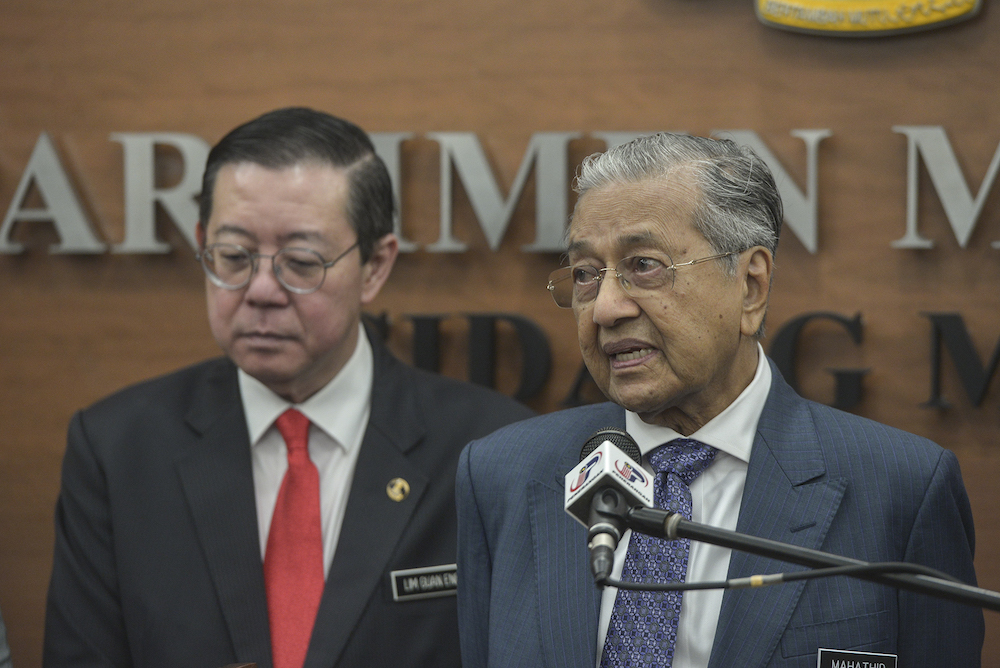 Prime Minister Tun Dr Mahathir Mohamad speaks to reporters in Parliament October 11, 2019, after the tabling of Budget 2020. — Picture by Shafwan Zaidon