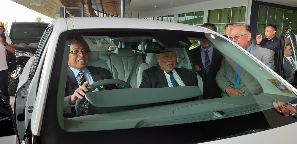 Sarawak Chief Minister Datuk Patinggi Abang Johari Openg giving a demonstration on the hydrogen-powered sports utility vehicle in Kuching October 23, 2019. — Picture by Sulok Tawie
