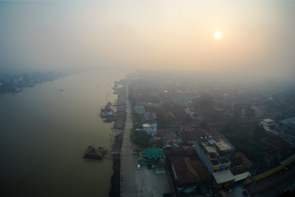 A general view shows haze caused by forest fires over the Musi river in Palembang, South Sumatra province September 7, 2019. u00e2u20acu201d AFP pic