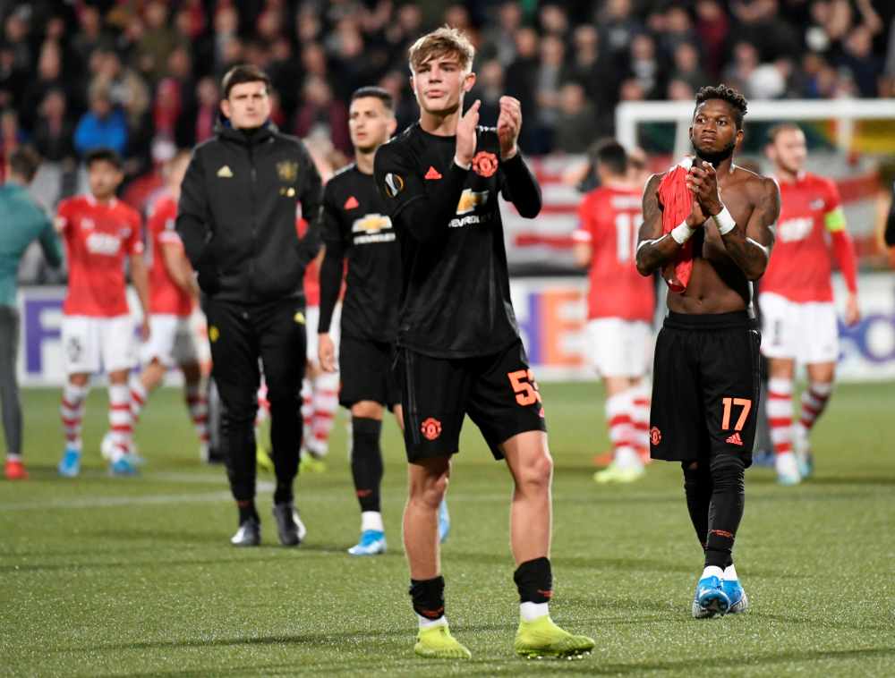 Manchester United's Fred and Brandon Williams applaud the fans after the match against AZ Alkmaar, October 4, 2019. u00e2u20acu2022 Reuters pic