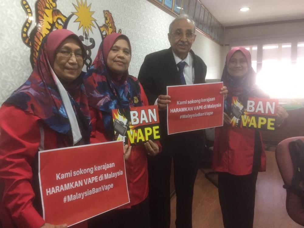 Members of the coalition of NGOs seeking a blanket ban on e-cigarettes and vaping devices pose for pictures at a press conference. — Picture courtesy of Smoke Free Malaysia Initiative