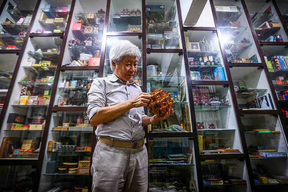 For Lee, one of the best parts of travelling around the world has always been visiting the antiquarian bookstores, to find rare and unique puzzles that he could never get in Malaysia. — Picture by Hari Anggara