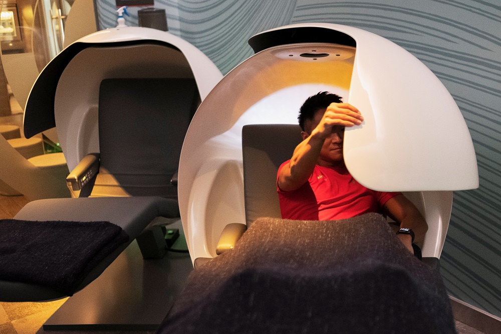 A Virgin Active employee adjusts the privacy visor of a MetroNaps EnergyPod as he demonstrates the use of the equipment for power naps at their fitness club in central Singapore March 5, 2019. u00e2u20acu201d Reuters pic