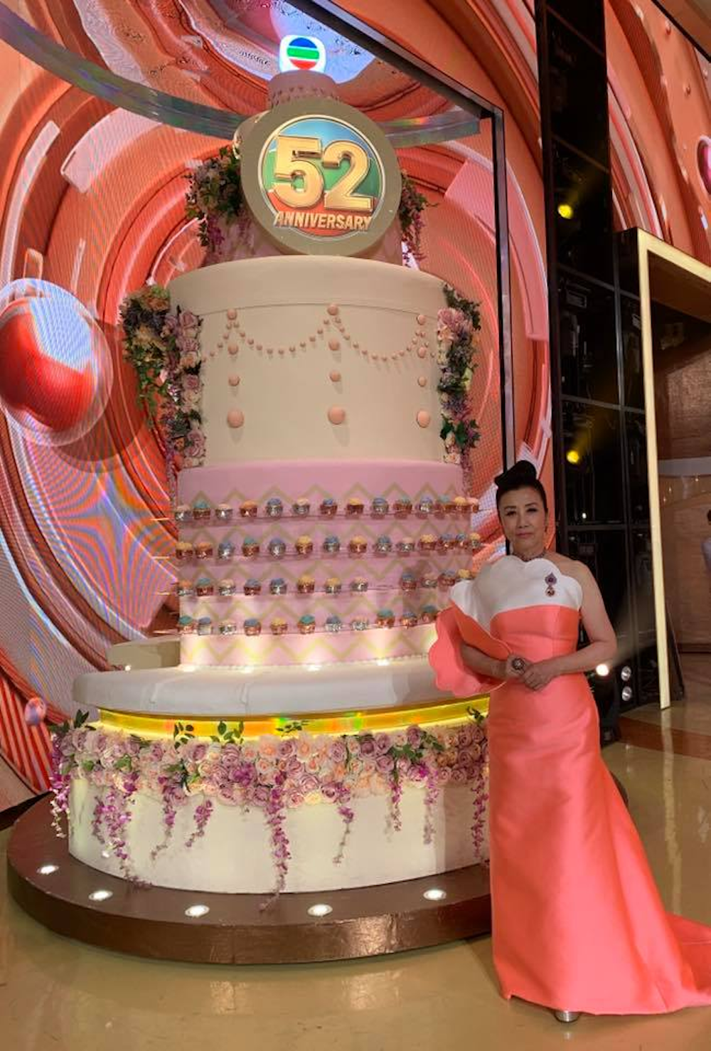 Co-host of the programme Hong Kong actress and singer Liza Wang with the anniversary cake in conjunction with TVB's 52nd anniversary celebration. u00e2u20acu201d Facebook/ Lizawangliza