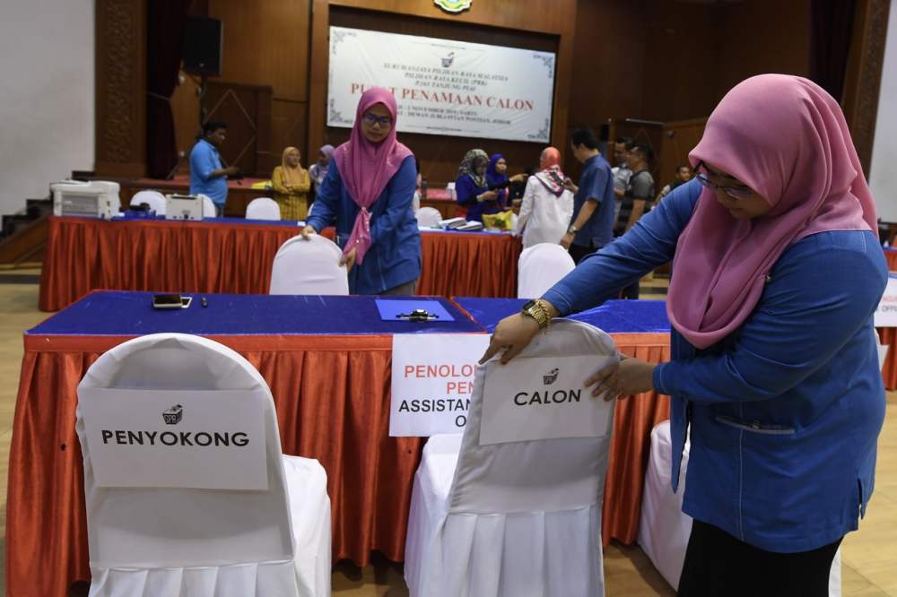 An Election Commission officer makes final preparations for the by-election at a polling centre in Pontian November 2, 2019. u00e2u20acu201d Bernama pic
