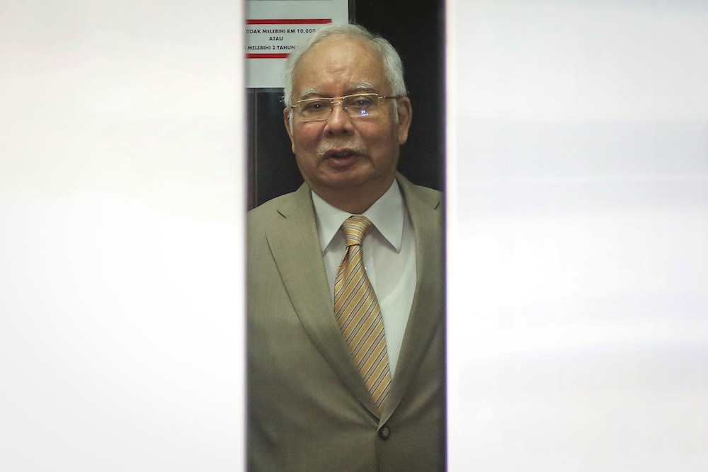 Former prime minister Datuk Seri Najib Razak leaves the courtroom for a short recess during his trial at the Kuala Lumpur High Court December 11, 2019. u00e2u20acu201d Picture by Yusof Mat Isa