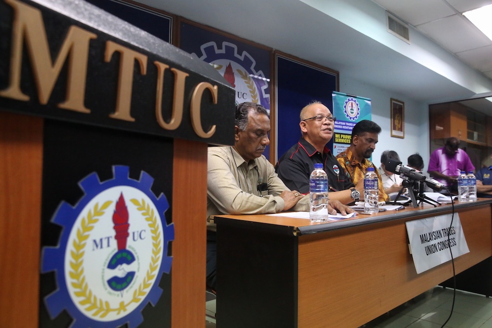(From left) MTUC vice-president (private sector) R. Jey Kumar, president Datuk Abdul Halim Mansor and secretary-general J. Solomon attend a press conference in Subang Jaya December 26, 2019. u00e2u20acu201d Picture by Choo Choy May