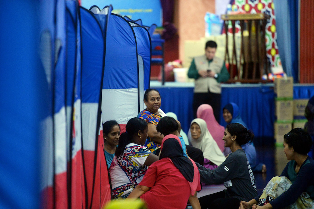 Families seek shelter at a flood relief centre in the Kota Tinggi Vocational College in Kota Tinggi December 10, 2019. u00e2u20acu201d Bernama pic