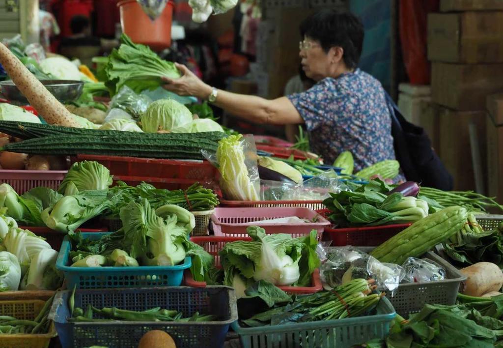 Vegetable stalls at the Chong Pang City Wet Market in Singapore: Wholesale prices of vegetables have risen up to 80 per cent due to floods in Malaysia. u00e2u20acu201d TODAY pic