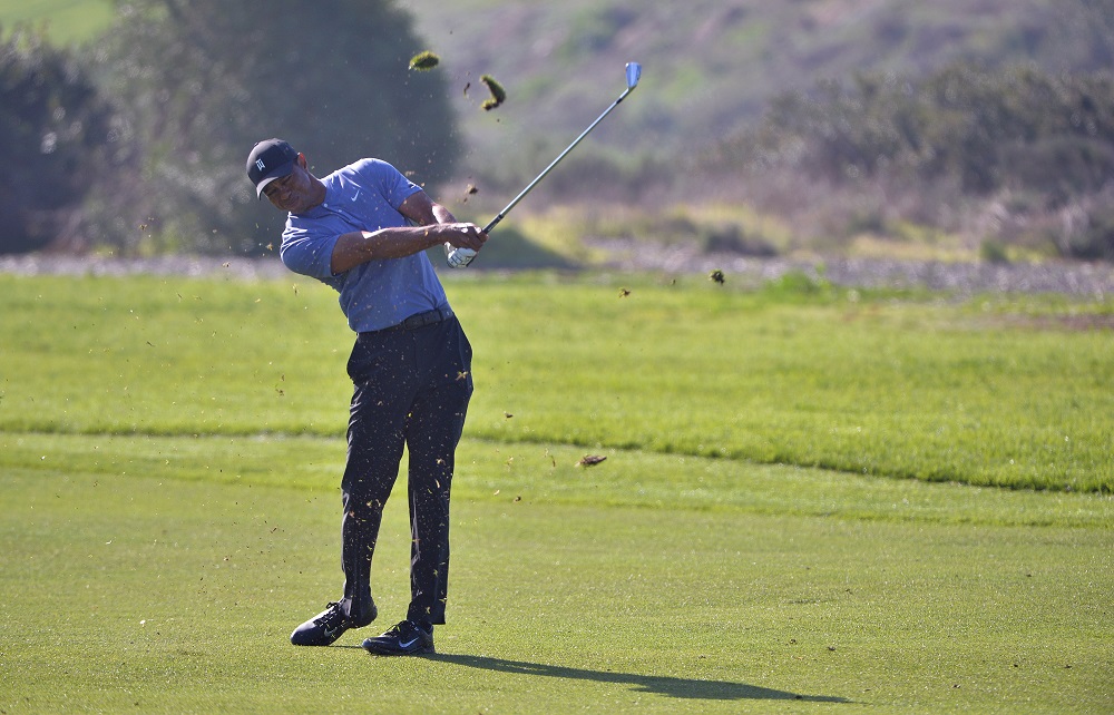 Tiger Woods plays his second shot on the 13th hole during the first round of the Farmers Insurance Open golf tournament at Torrey Pines Municipal Golf Course in San Diego January 23, 2020. u00e2u20acu201d Picture by Orlando Ramirez-USA TODAY Sports via Reuters