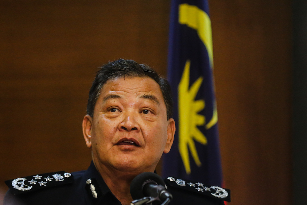 IGP Tan Sri Abdul Hamid Badorexplained to the members of the media this afternoon that there are several categories in Interpol when it comes to Red Notice. — Picture by Firdaus Latif