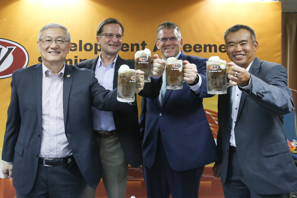 (From left) Martin Lim, Kevin Bazner, Dean Thompson and A&W Malaysia CEO George Ang pose for pictures with root beer in Petaling Jaya January 10, 2020. u00e2u20acu201d Picture by Yusof Mat Isa