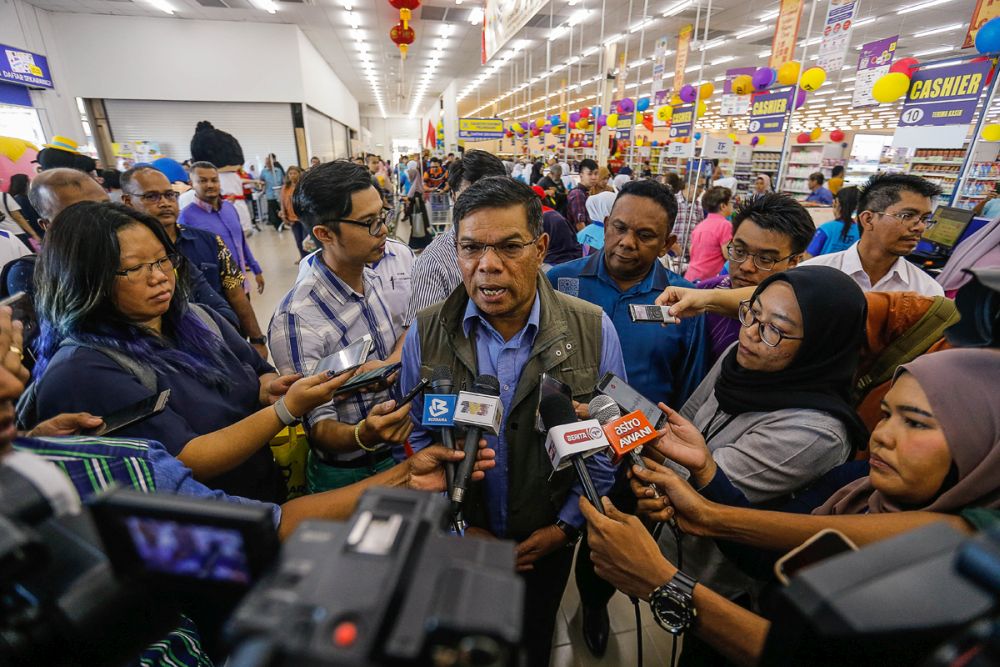 Domestic Trade and Consumer Affairs Minister Datuk Seri Saifuddin Nasution Ismail speaks to reporters at the official opening ceremony of TF Value-Mart in Balik Pulau January 9, 2020. — Picture by Sayuti Zainudin