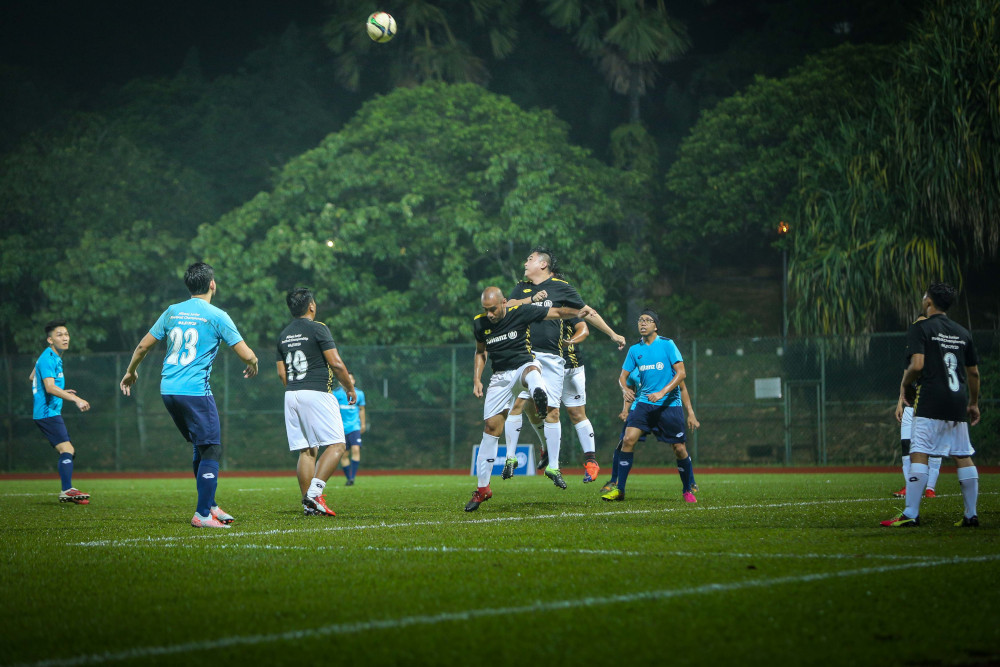 Players vie for the ball during the friendly match at Stadium UM Arena. — Picture courtesy of Allianz Malaysia Berhad