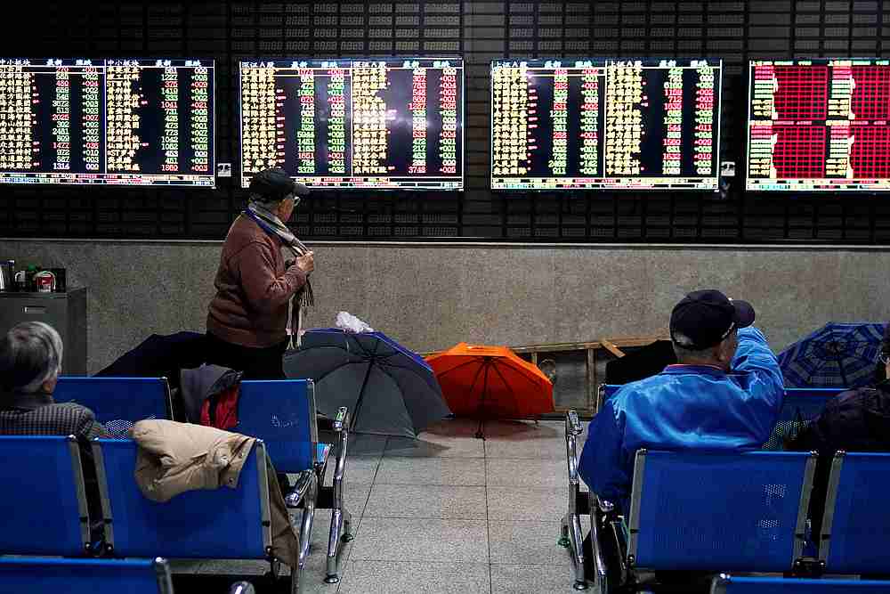 Investors look at screens showing stock information at a brokerage house in Shanghai, China January 16, 2020. u00e2u20acu201d Reuters pic