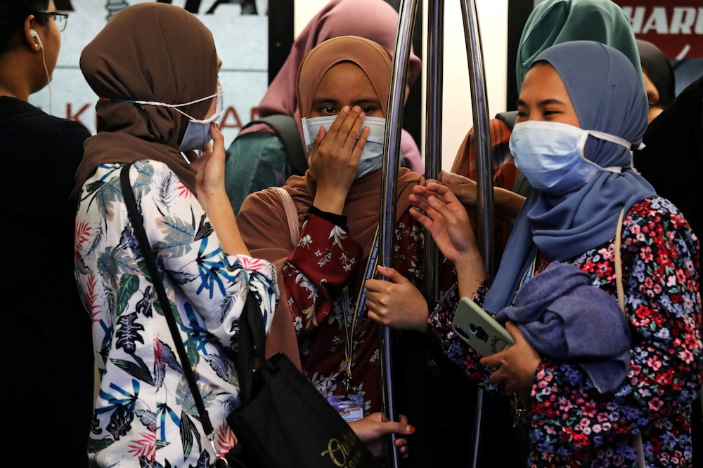 Passengers wear masks in a Light Rail Transit train in Kuala Lumpur January 31, 2020. u00e2u20acu201d Reuters pic