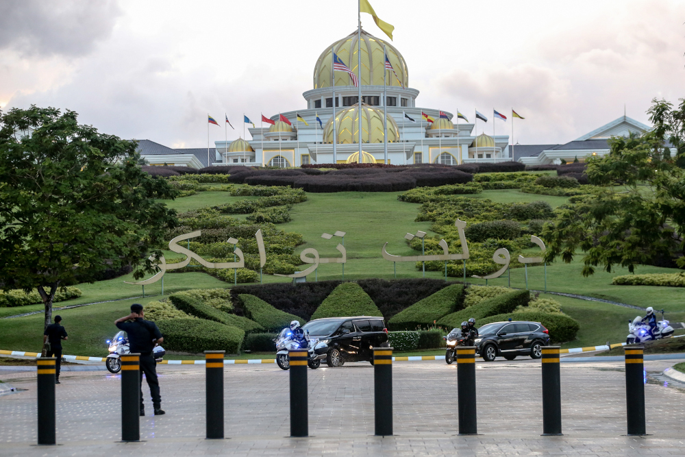 Luxury vehicles believed to be carrying senior political leaders leave Istana Negara February 23, 2020. u00e2u20acu201d Picture by Firdaus Latif