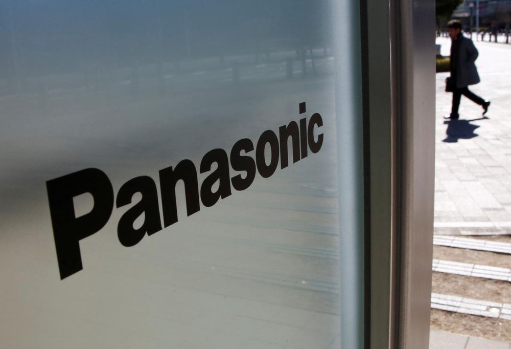 A man is seen next to Panasonic Corp's logo at Panasonic Center in Tokyo, Japan, February 2, 2017. u00e2u20acu201d Reuters pic