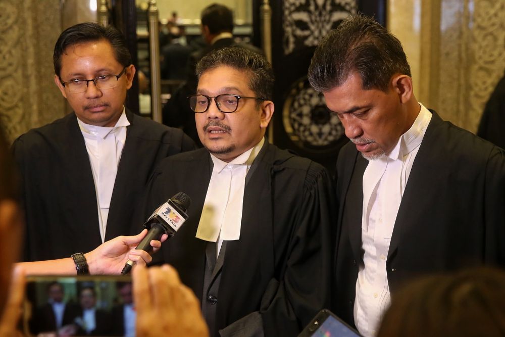 Lawyer Datuk Zainul Rijal Abu Bakar (centre) speaks to reporters at the Federal Court in Putrajaya February 13, 2020. ― Picture by Choo Choy May