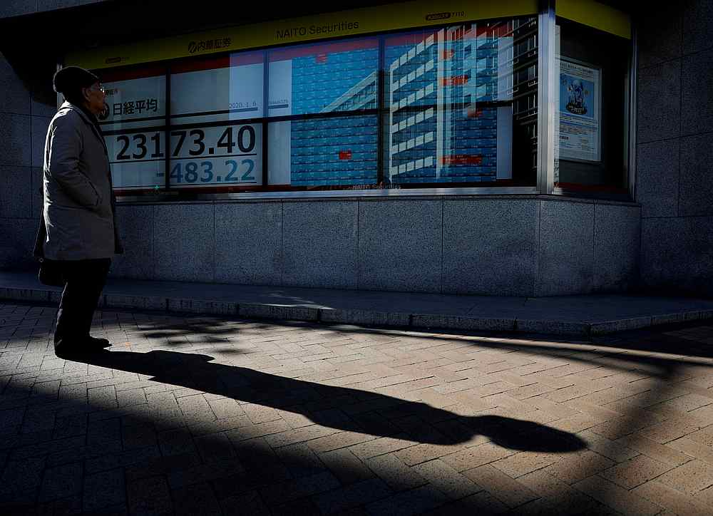 A man looks at a board showing stock prices outside a brokerage in Tokyo, Japan January 6, 2020. u00e2u20acu201d Reuters pic 