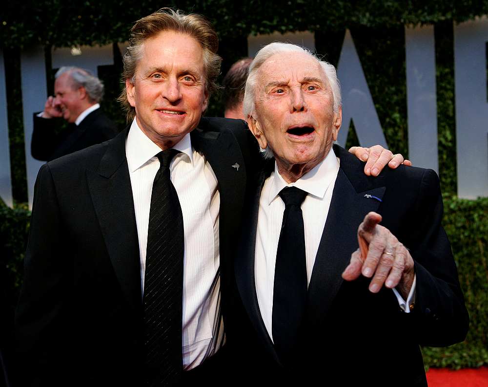 Actor Michael Douglas (left) and his father, actor Kirk Douglas, arrive together at the 2009 Vanity Fair Oscar Party in West Hollywood, California February 22, 2009. — Reuters pic