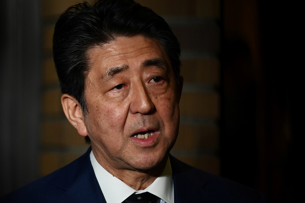 Japan's Prime Minister Shinzo Abe talks to the journalists in front of the prime minister's residence in Tokyo March 24, 2020. u00e2u20acu201d Reuters pic