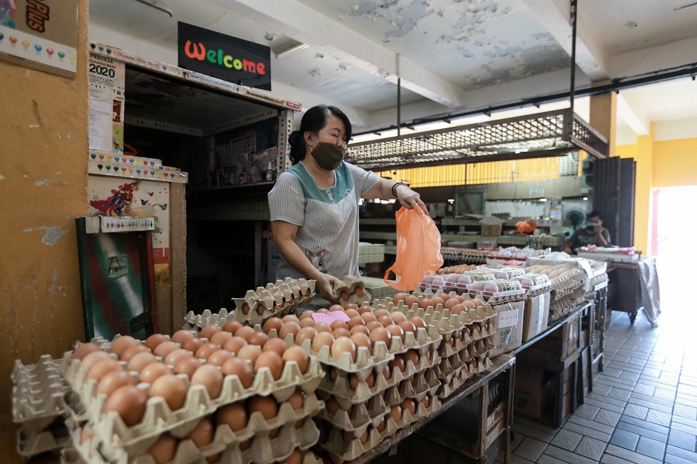 Hor is pictured selling fresh eggs at the Old Town Wet Market in Petaling Jaya March 25,2020.  — Picture by Ahmad Zamzahuri