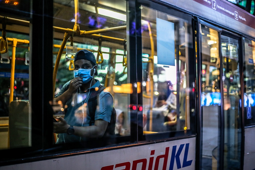 A bus passenger is seen wearing a face mask amid the Covid-19 outbreak in Kuala Lumpur March 16, 2020. u00e2u20acu201d Picture by Firdaus Latif 