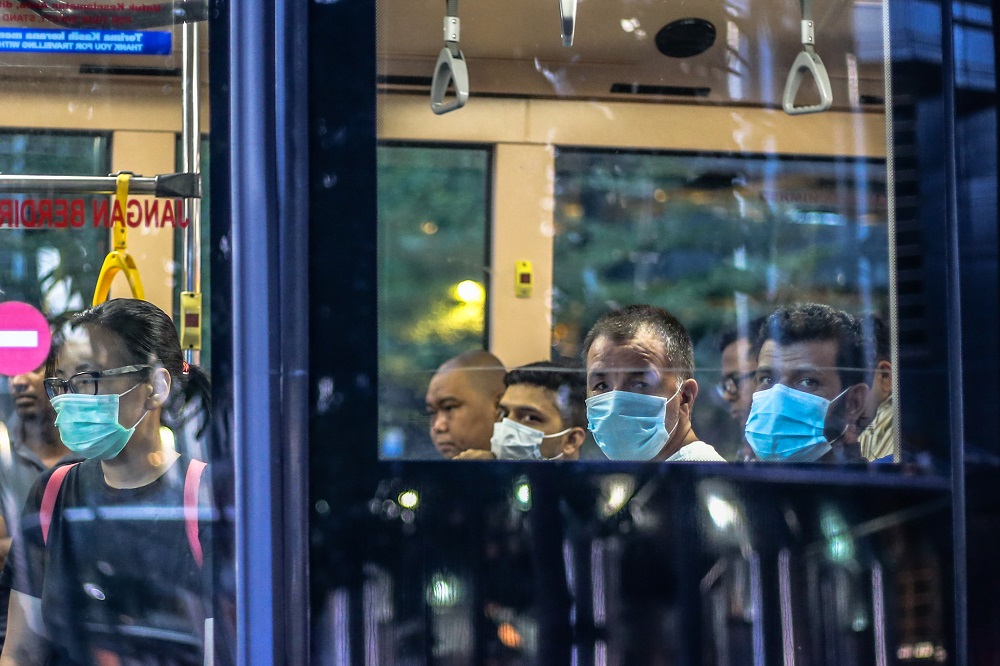 Bus passengers are seen wearing face masks amid the Covid-19 outbreak in Kuala Lumpur March 16, 2020. u00e2u20acu201d Picture by Firdaus Latif 