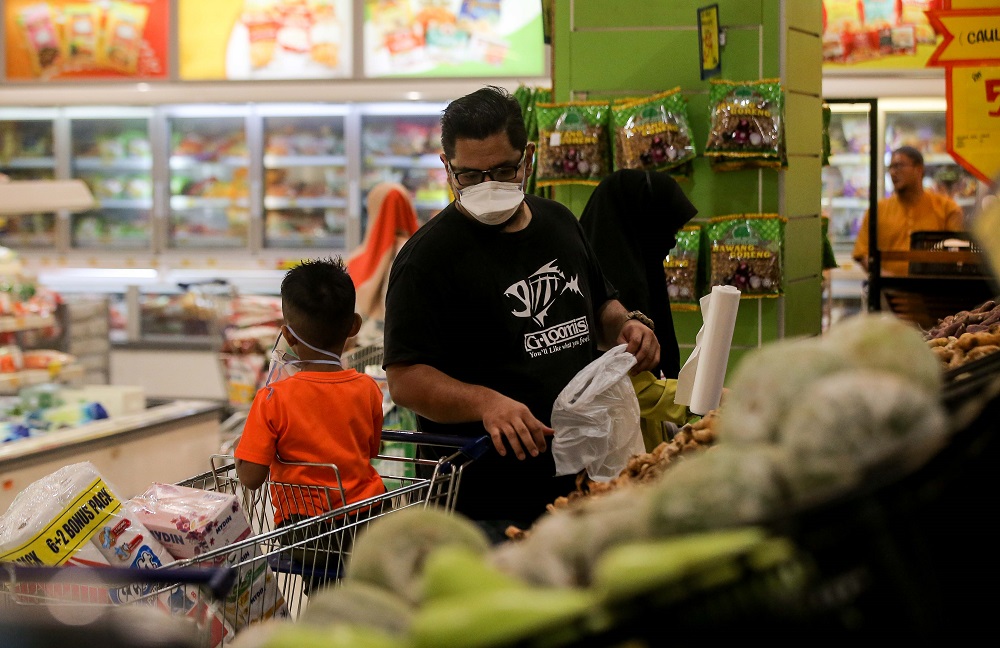 People are seen shopping at the produce aisle at Mydin Meru Raya in Ipoh March 16, 2020. u00e2u20acu201d Picture by Farhan Najib