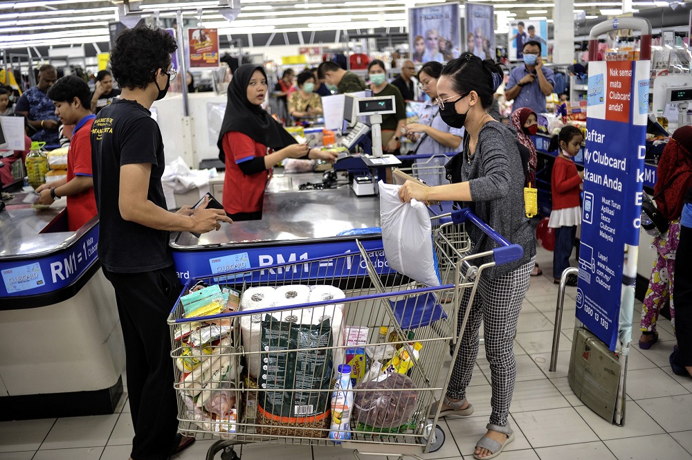 People are seen stocking up on food and other goods during the panic buying at a hypermarket in Kajang March 16, 2020. u00e2u20acu201d Picture by Shafwan Zaidonnn