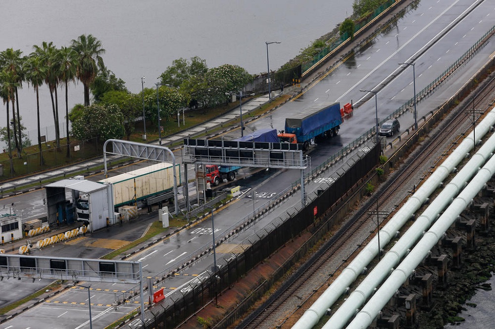 Trucks transporting goods between Singapore and Malaysia seen at the Causeway on March 18, 2020. u00e2u20acu201d TODAY pic