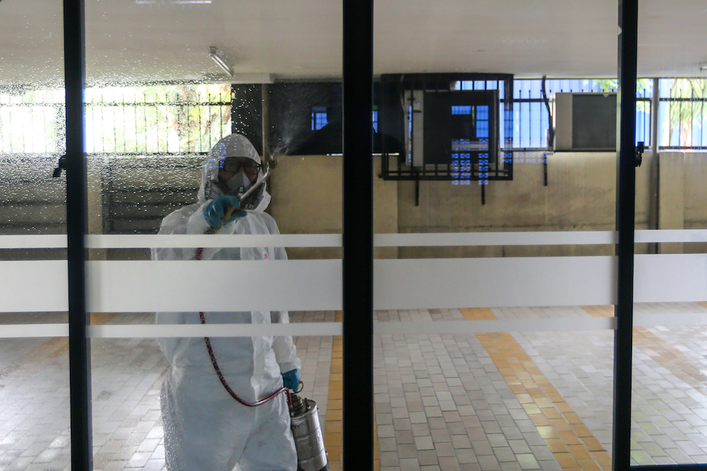A worker sprays disinfectant in a mosque to prevent the spread of the novel coronavirus in Kuala Lumpur March 23, 2020. u00e2u20acu201d Picture by Firdaus Latif 