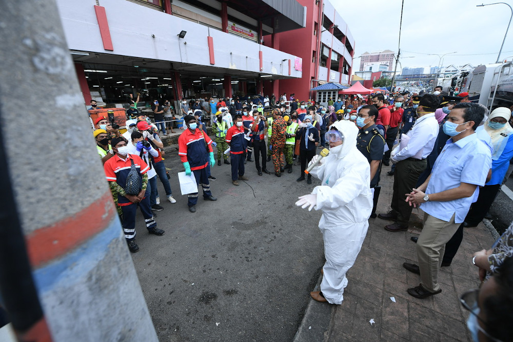 Housing and Local Government Minister Zuraida Kamaruddin carries out a public disinfection operation at a wet market in Jalan Othman March 31, 2020. u00e2u20acu201d Bernama pic