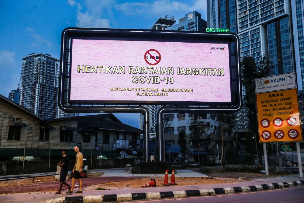 A billboard displaying a message on the movement control order is pictured in Kuala Lumpur March 31, 2020. u00e2u20acu201d Picture by Firdaus Latif