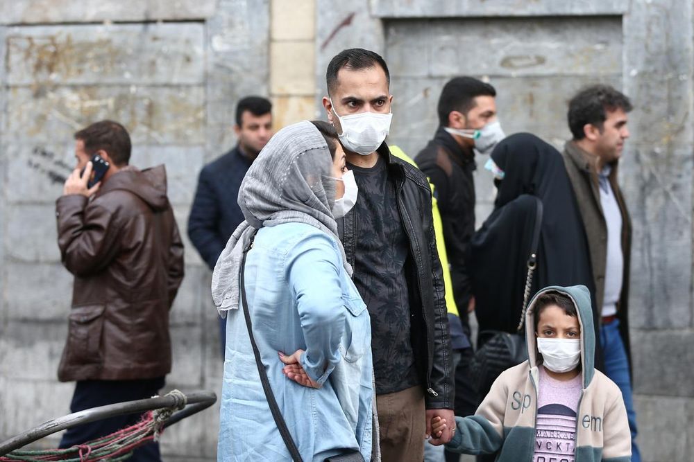 Iranian family wear protective masks to prevent contracting a coronavirus, as they stand at Grand Bazaar in Tehran, Iran February 20, 2020. u00e2u20acu201d West Asia News Agency/Nazanin Tabatabaee via Reuters