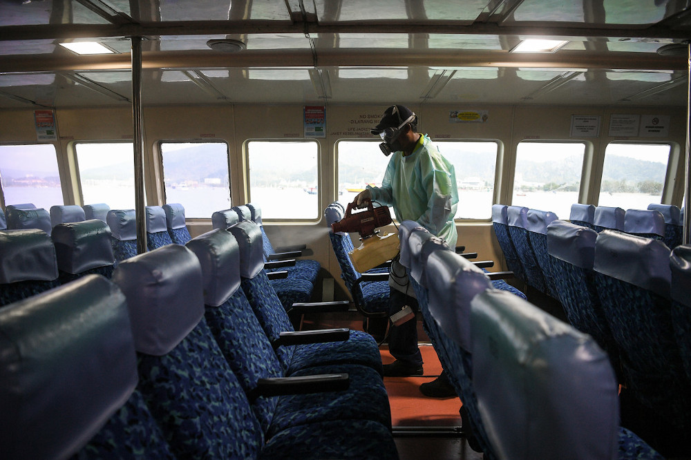 A Ferry Line Ventures Sdn Bhd employee cleaning the interior of a ferry to prevent the spread of Covid-19 in Langkawi March 11, 2020. u00e2u20acu201d Bernama pic 