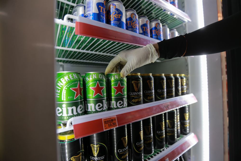 Beer for sale at a convenience store in Petaling Jaya March 25, 2020. u00e2u20acu201d Picture by Ahmad Zamzahuri