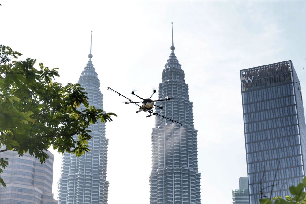 A drone is used to spray disinfectant in Kampung Baru to curb spread of Covid-19 in Kuala Lumpur March 31, 2020. u00e2u20acu201d Picture by Ahmad Zamzahuri