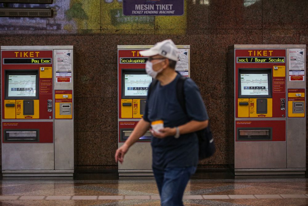 A commuter wearing a face mask is pictured at the KL Sentral public transportation hub in Kuala Lumpur March 18, 2020. u00e2u20acu201d Picture by Hari Anggara
