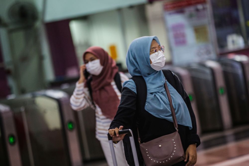 Commuters wearing face masks are pictured at KL Sentral, Kuala Lumpur March 18, 2020. — Picture by Hari Anggara
