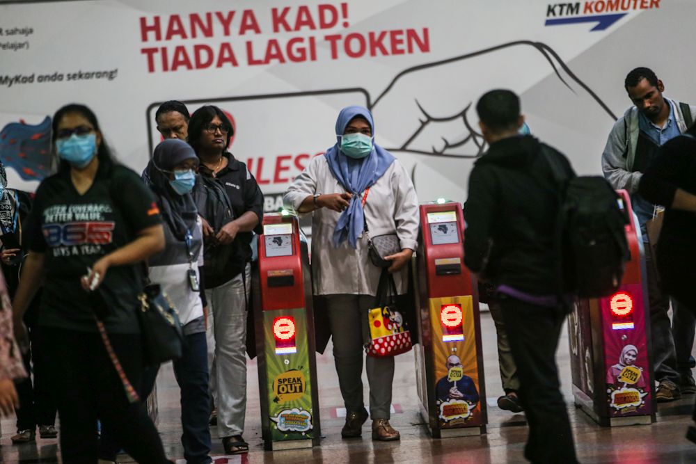Commuters wearing face masks are pictured at the KL Sentral public transportation hub in Kuala Lumpur March 18, 2020. u00e2u20acu201d Picture by Hari Anggara