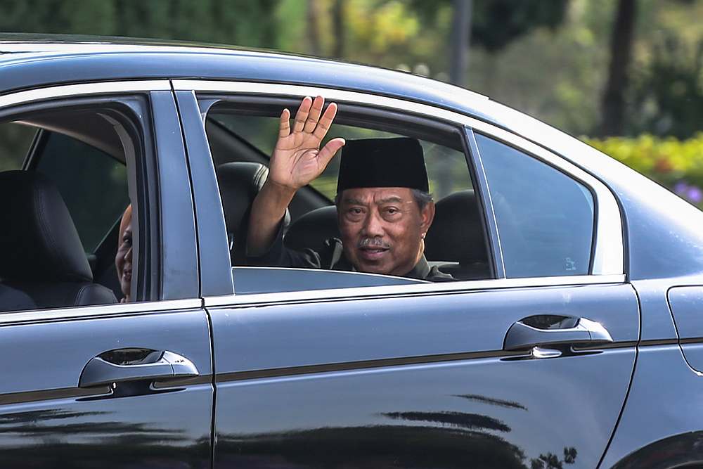 Tan Sri Muhyiddin Yassin waves as he arrives at Istana Negara in Kuala Lumpur March 1, 2020. u00e2u20acu201d Picture by Firdaus Latif 