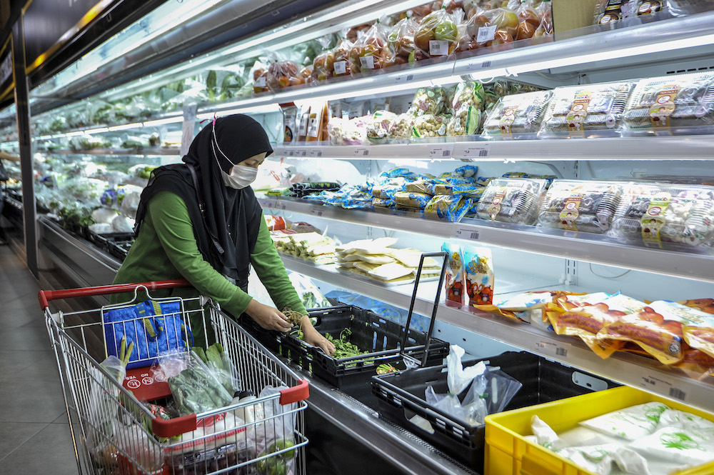 A customer buying a groceries at a supermarket in Cyberjaya April 5, 2020. u00e2u20acu201d Picture by Shafwan Zaidon